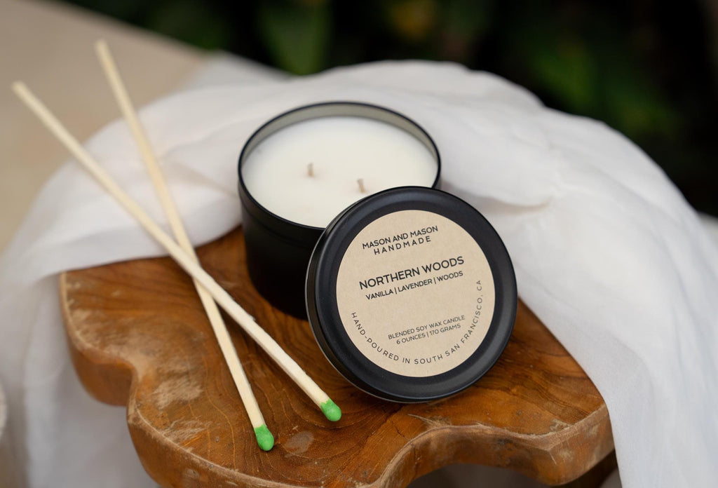 Mason and Mason Northern Woods candle with match sticks on a wooden tray