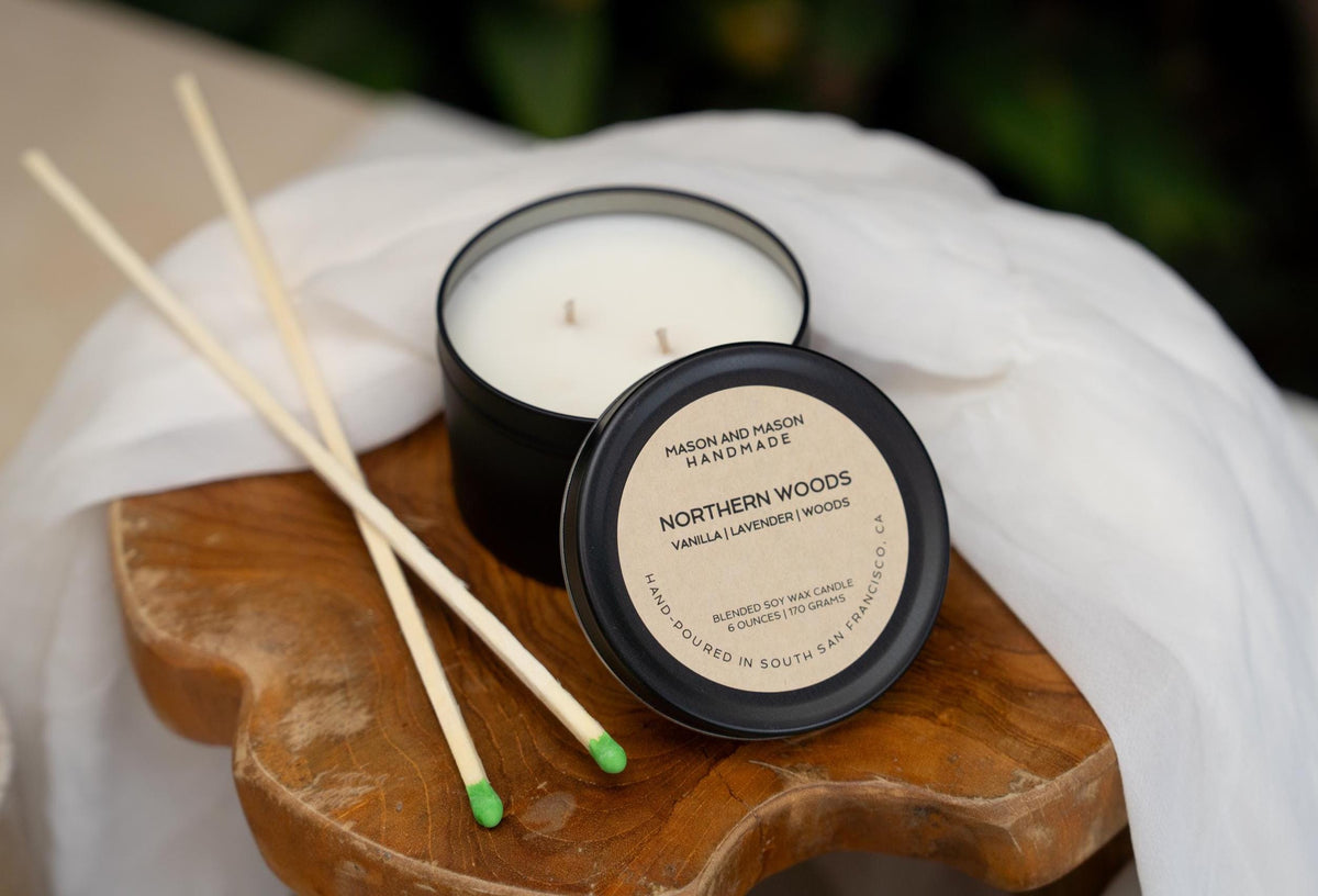 Mason and Mason Northern Woods candle with match sticks on a wooden tray